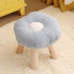 Soft flower-shaped stool with wooden legs