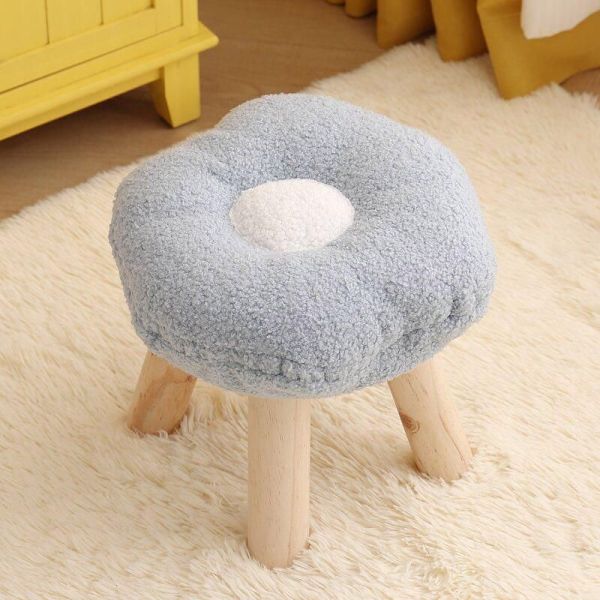 Soft flower-shaped stool with wooden legs
