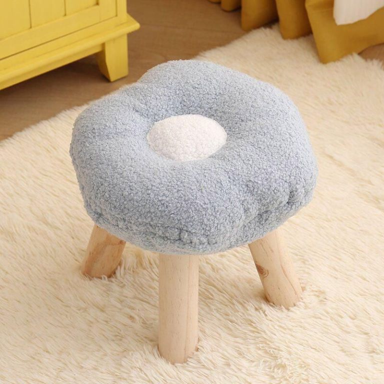 Soft flower-shaped stool with wooden legs