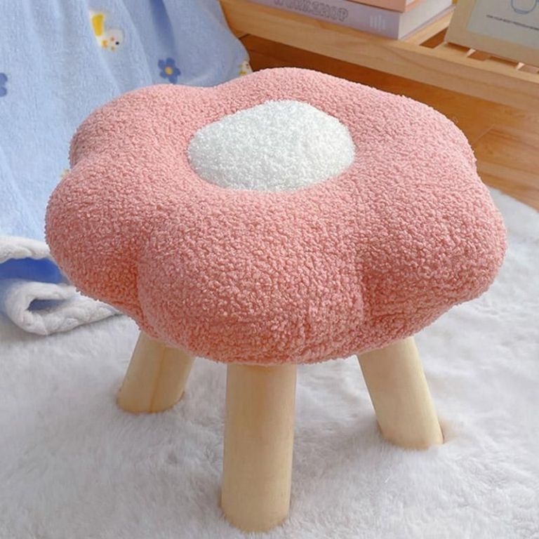 Pink flower-shaped stool with wooden legs