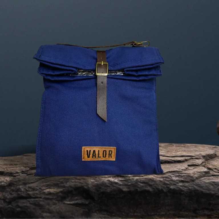 Blue canvas bag with leather strap and buckle