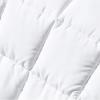 Close-up of white quilted fabric texture