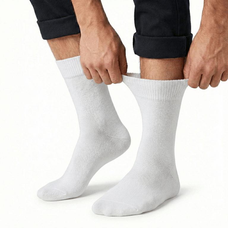 Person pulling up white crew socks