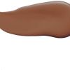 Brown cosmetic foundation swatch on white background