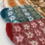 Colourful fuzzy patterned socks lined up