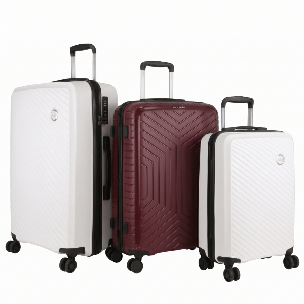 Three hard-shell suitcases with spinner wheels