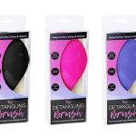 Three packaged detangling hair brushes in assorted colours