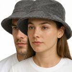 Two people wearing grey bucket hats close-up