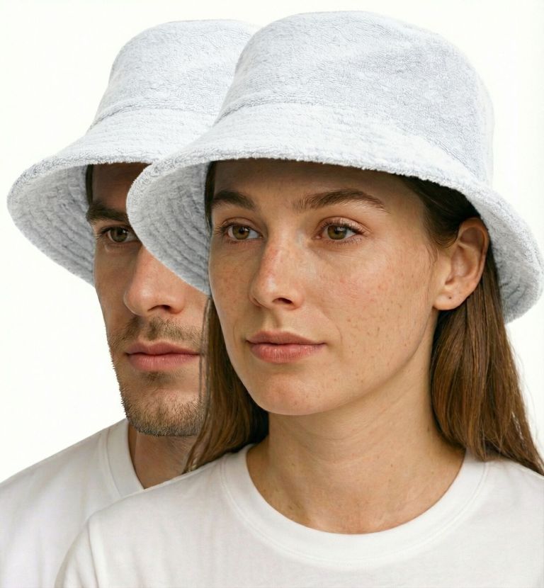Two people wearing white bucket hats indoors