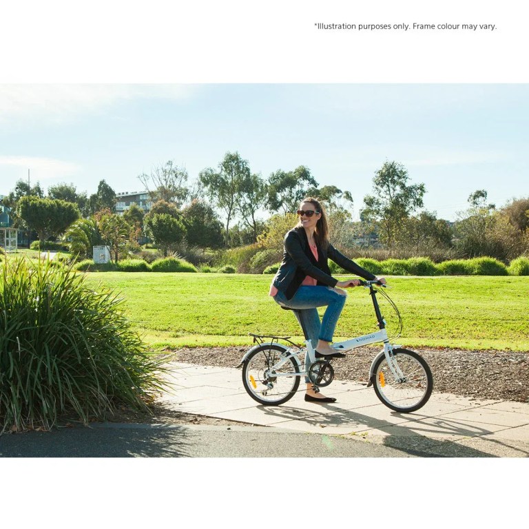 progear bikes nomad folding bike 20 in grey" Woman riding folding bike in sunny park