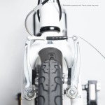 progear bikes nomad folding bike 20 in pearl white" Close-up of bicycle front V-brake and tyre