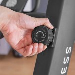 Hand adjusting exercise bike tension control knob
