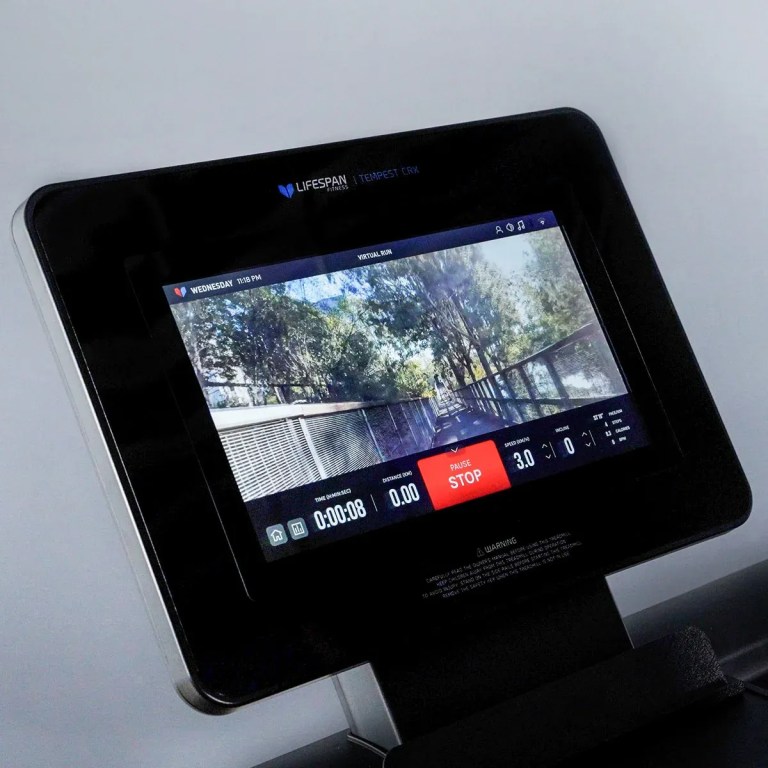 Treadmill screen displaying virtual outdoor running track