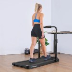 Woman walking on treadmill desk at home