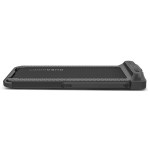 Compact black foldable treadmill on white background