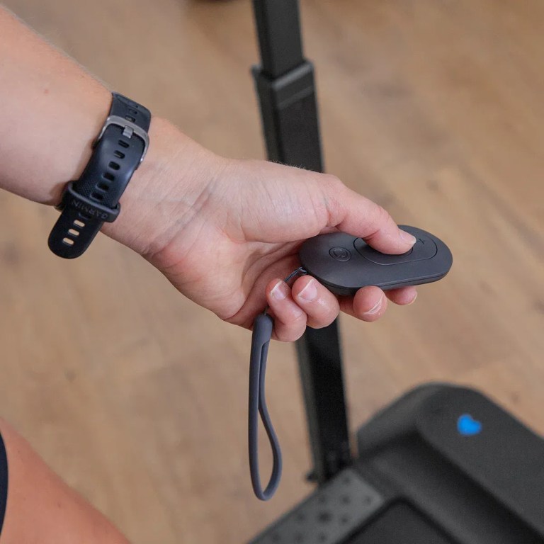Hand holding remote control for electric scooter