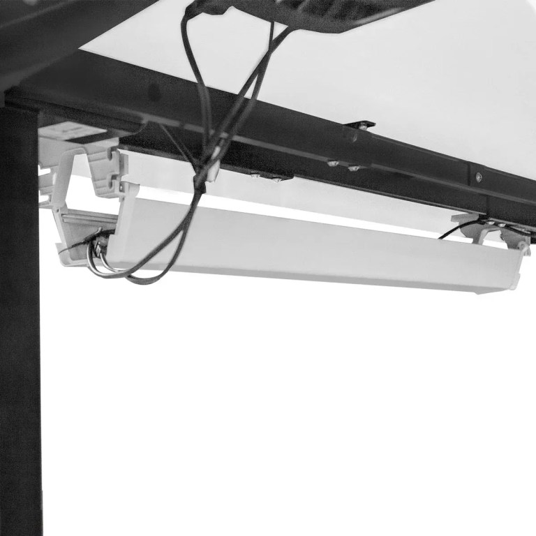 Ceiling-mounted fluorescent light fixture with exposed wiring