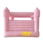 Pink inflatable jumping castle with warning label