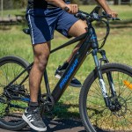 progear e vantage 27.5*18 mtb e bike black shadow" Person riding black electric bike in park
