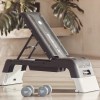reebok deck white Reebok adjustable step bench with dumbbells indoors