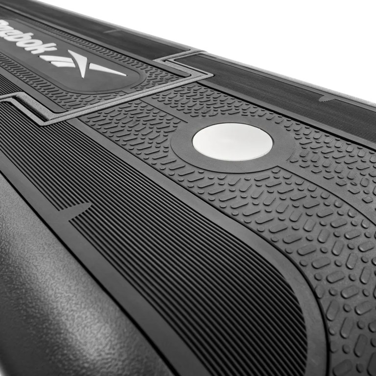 Close-up of textured treadmill running belt surface