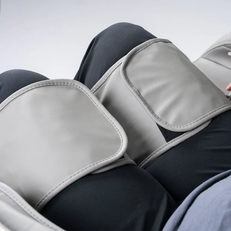 regen8 luxcloud air zero gravity heated massage chair Grey leg massager wraps on person’s legs