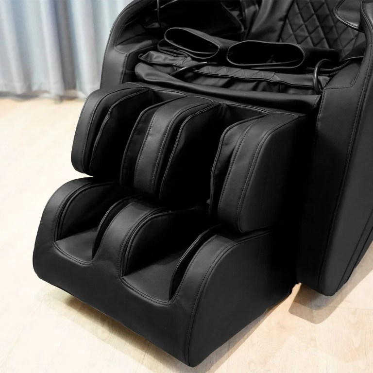 Black leather massage chair with leg massager