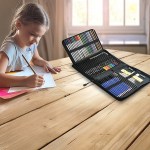 Young girl drawing with coloured pencils at table