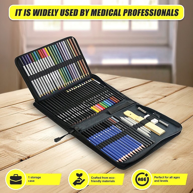 Open coloured pencil art set on wooden table