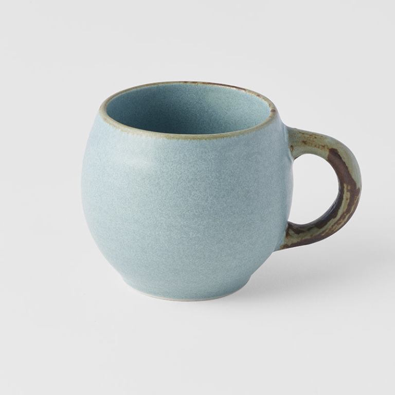 Light blue ceramic mug with rustic handle
