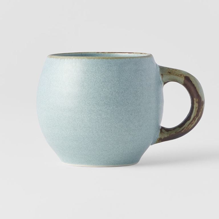 Light blue ceramic mug with brown handle