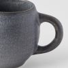 Close-up of grey ceramic mug handle