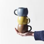 maru mug 300ml ash grey glaze Hand holding three stacked ceramic mugs