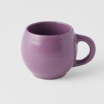 Purple ceramic mug on white background