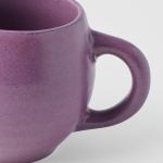 Close-up of purple ceramic mug handle