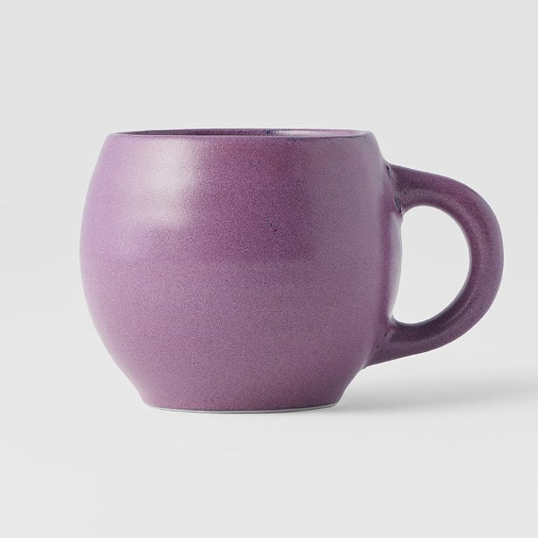 Purple ceramic coffee mug on white background