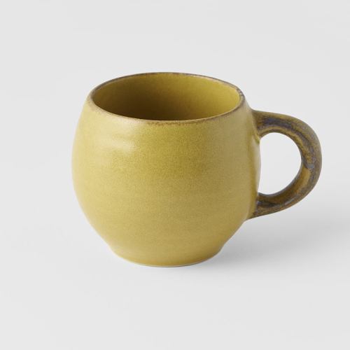 Yellow ceramic mug with rounded handle