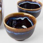 tea set 5pcs tenmokku bright blue glaze Glazed ceramic bowls filled with dark liquid