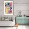 Framed colourful Chanel No.5 artwork above sofa