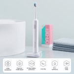 Electric toothbrush on stand in modern bathroom