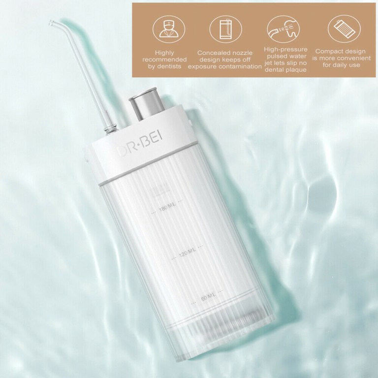 Portable water flosser on light blue surface
