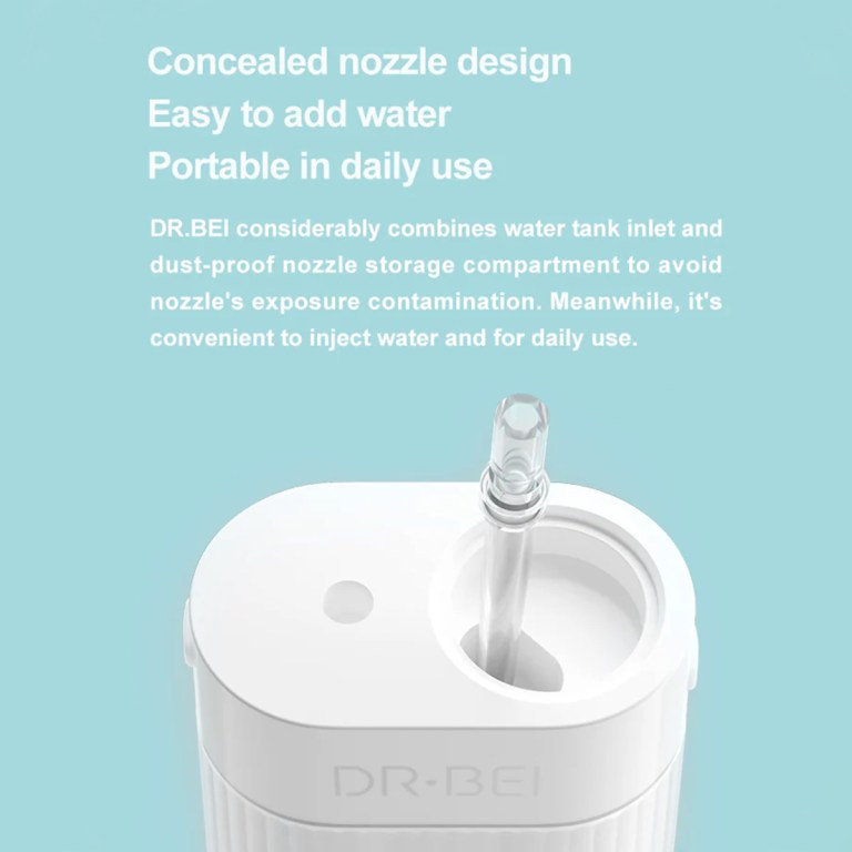 Portable water flosser with concealed nozzle design