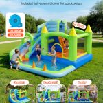 Kids playing on inflatable water slide in park
