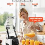 High-powered blender pouring fresh orange juice into glasses