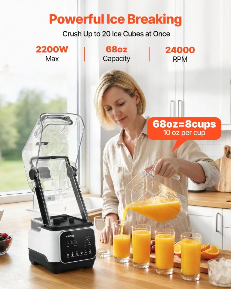 High-powered blender pouring fresh orange juice into glasses