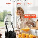 Woman pouring juice beside high-powered blender