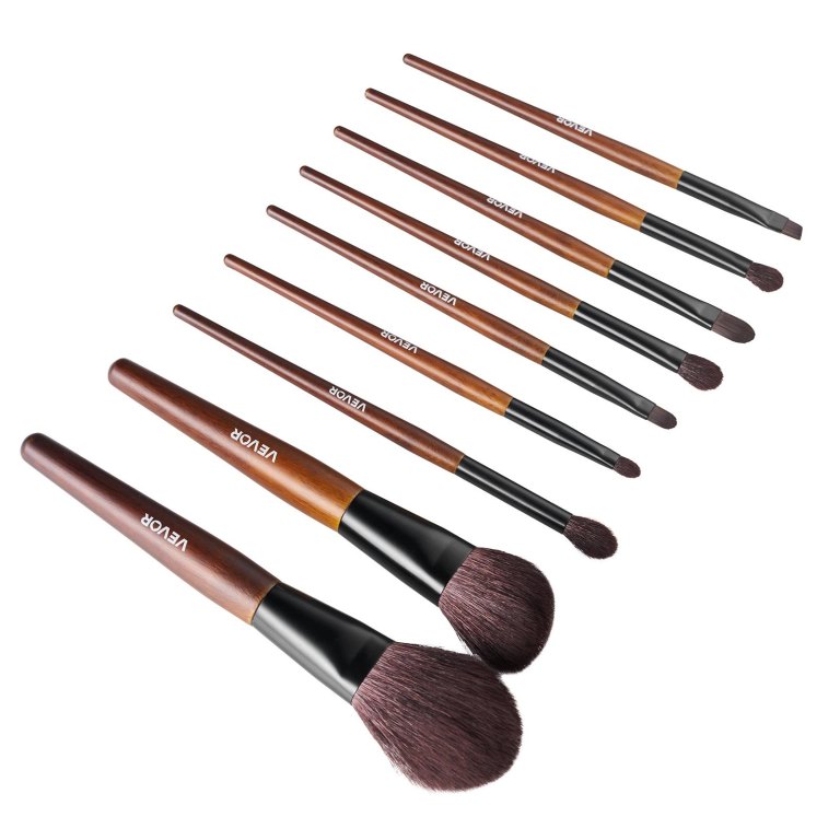 9 piece makeup brush set for foundation blending eyeshadow, professional makeup brush kit with soft natural wool & vegan synthetic bristles, ergonomic wood handle, travel friendly storage bag Set of wooden-handled makeup brushes on white background