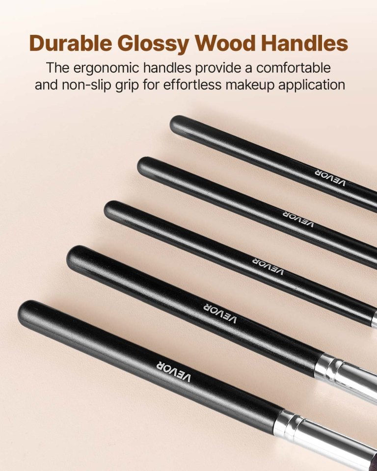 Glossy black wooden makeup brush handles close-up