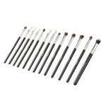 Set of assorted makeup brushes on white background