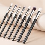 15 piece makeup brush set for foundation blending eyeshadow, professional vegan brushes with soft synthetic bristles, ergonomic wood handle & aluminum ferrule, portable and travel friendly Set of black-handled makeup brushes on beige background